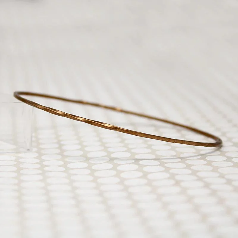 women’s friendship bracelets -The Endless Twist Oval Bangle in Bronze from Allie B.