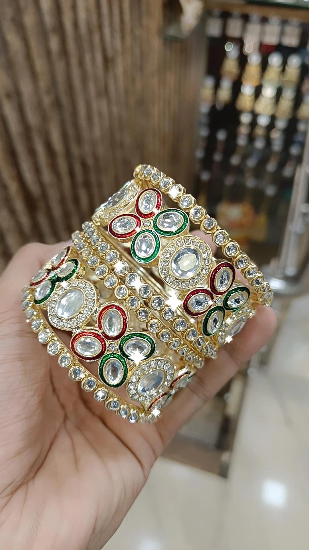 boho-style bracelets for women -Gold Kundan Bangles with Red-Green Crystal Accents and Stone Detailing