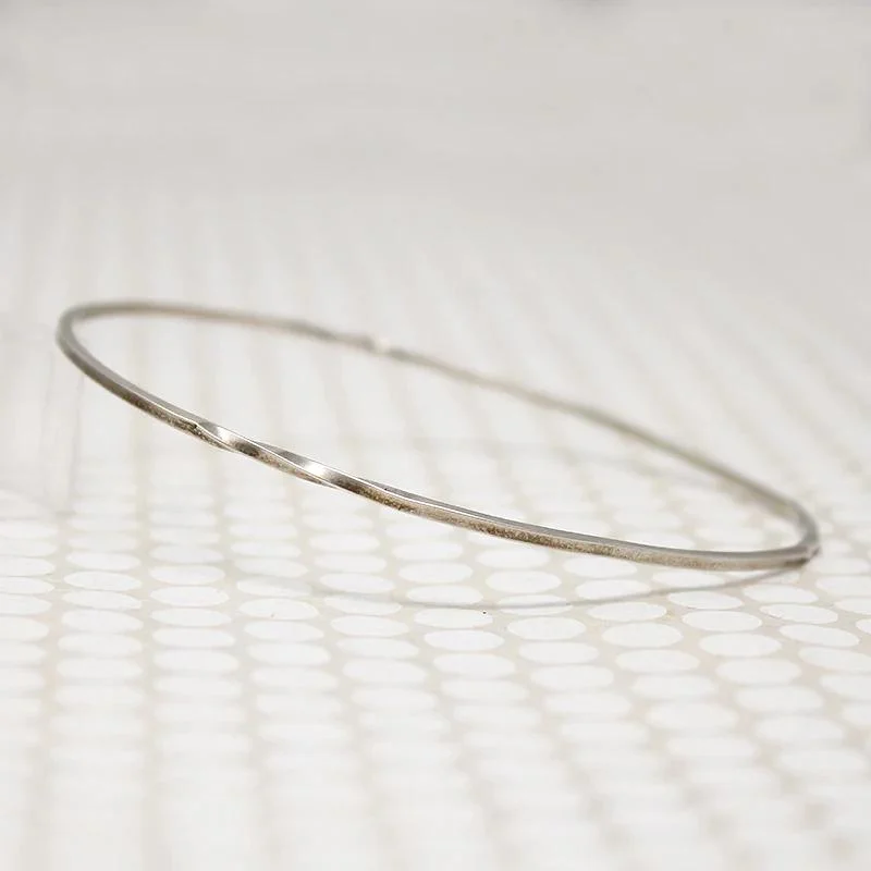 stylish bangles for women -The Endless Twist Oval Bangle in Sterling from Allie B.